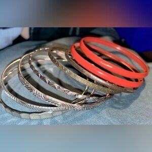 Bangle bracelet set. Silver-colored and orange.